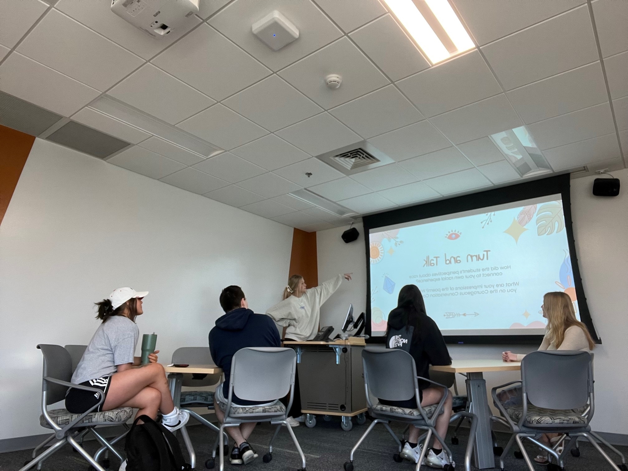 Dr. Elmer G. Redford '59 lab - students reviewing content on a projector screen while sitting at tables.