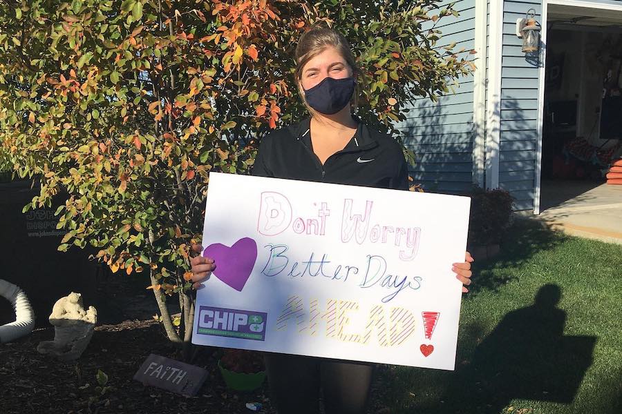 UW-Whitewater student communicating with a sign