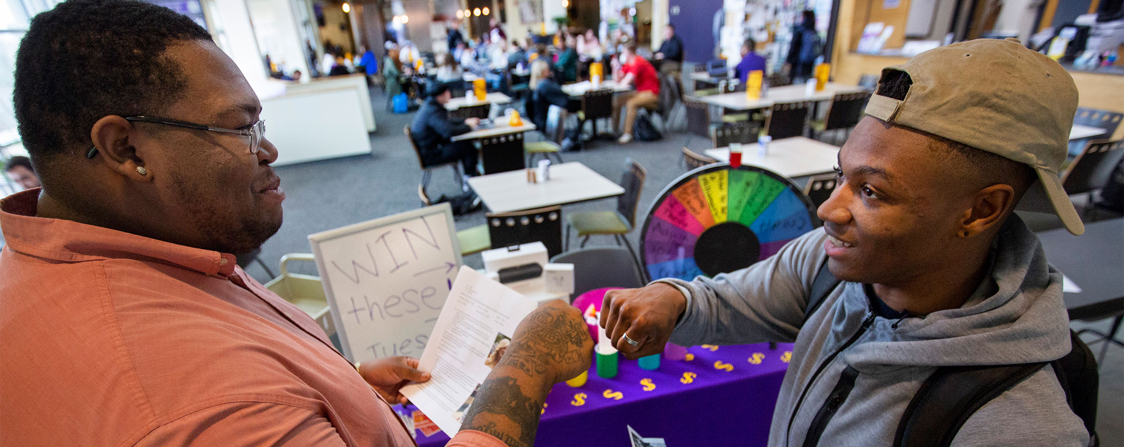 Andersen Library Outreach Coordinator Sarell Martin '17, promotes events in the library.