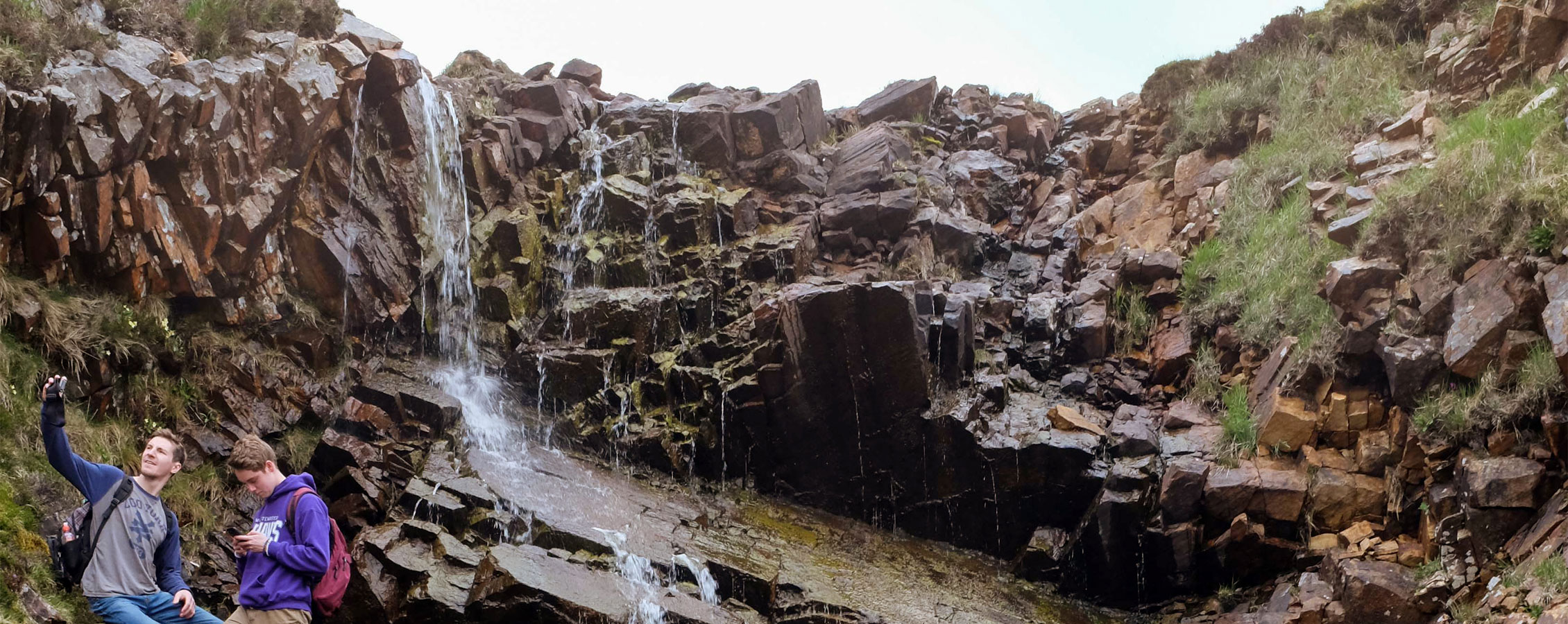 Students from UW-Whitewater visit a waterfall during a travel study.