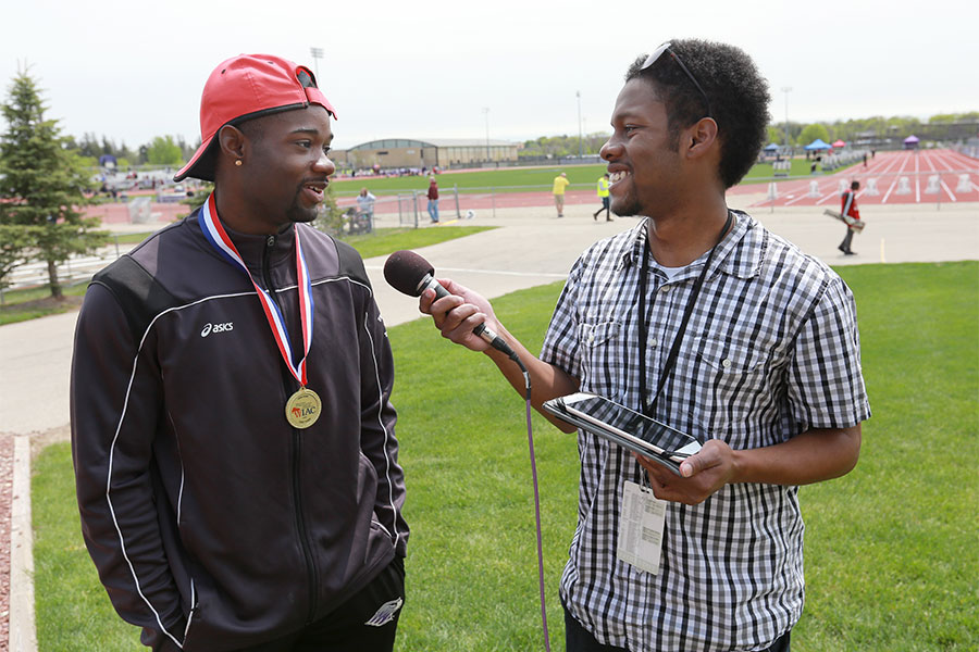  A student conducts an outdoor interview at UW-Whitewater.