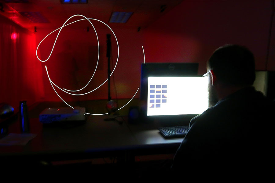 Media arts and game development student works in the studio on the University of Wisconsin Whitewater campus.