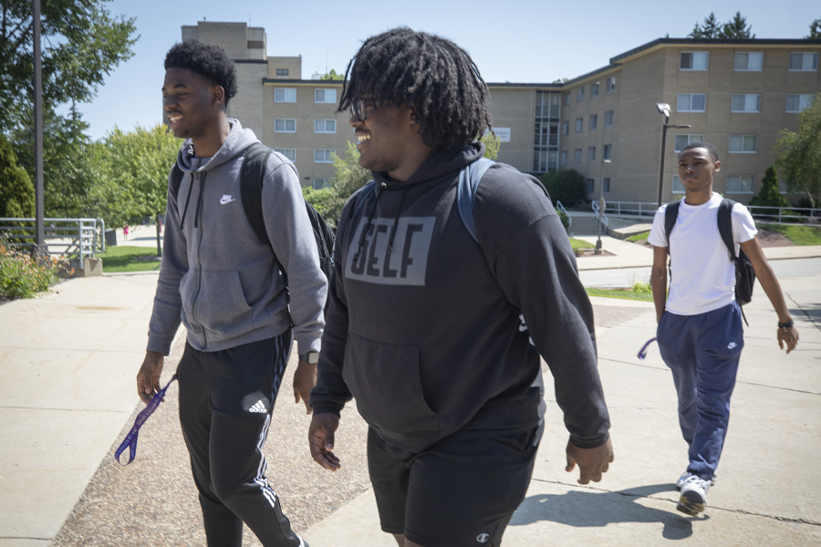 Students walk through campus.