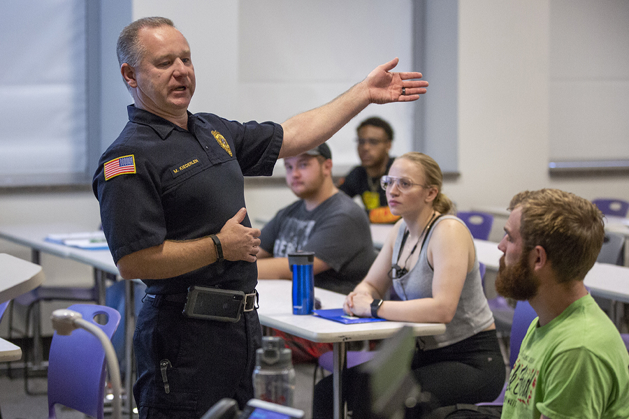 Chief Kiederlin speaks to a class.