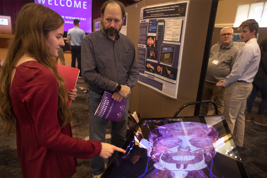 A student works with a faculty member during Undergraduate Research Day.