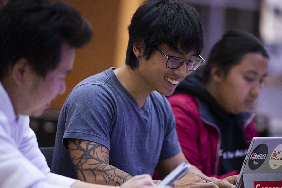 A student works on a laptop.