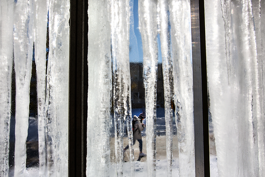 Icicles hang off a building.