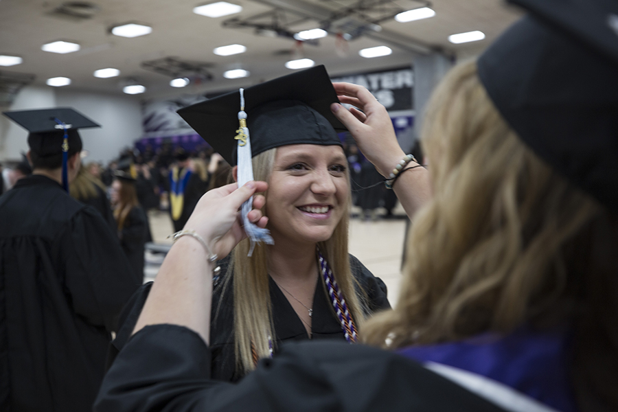 A student at graduation in their cap and gown.