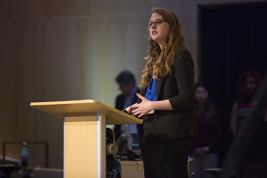 A student speaks at a podium.