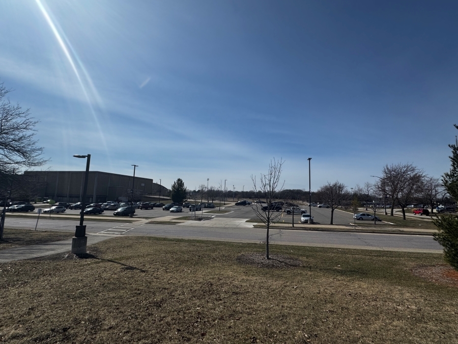 Picture of Lot 11 taken from across the street, sunny day with a clear blue sky.