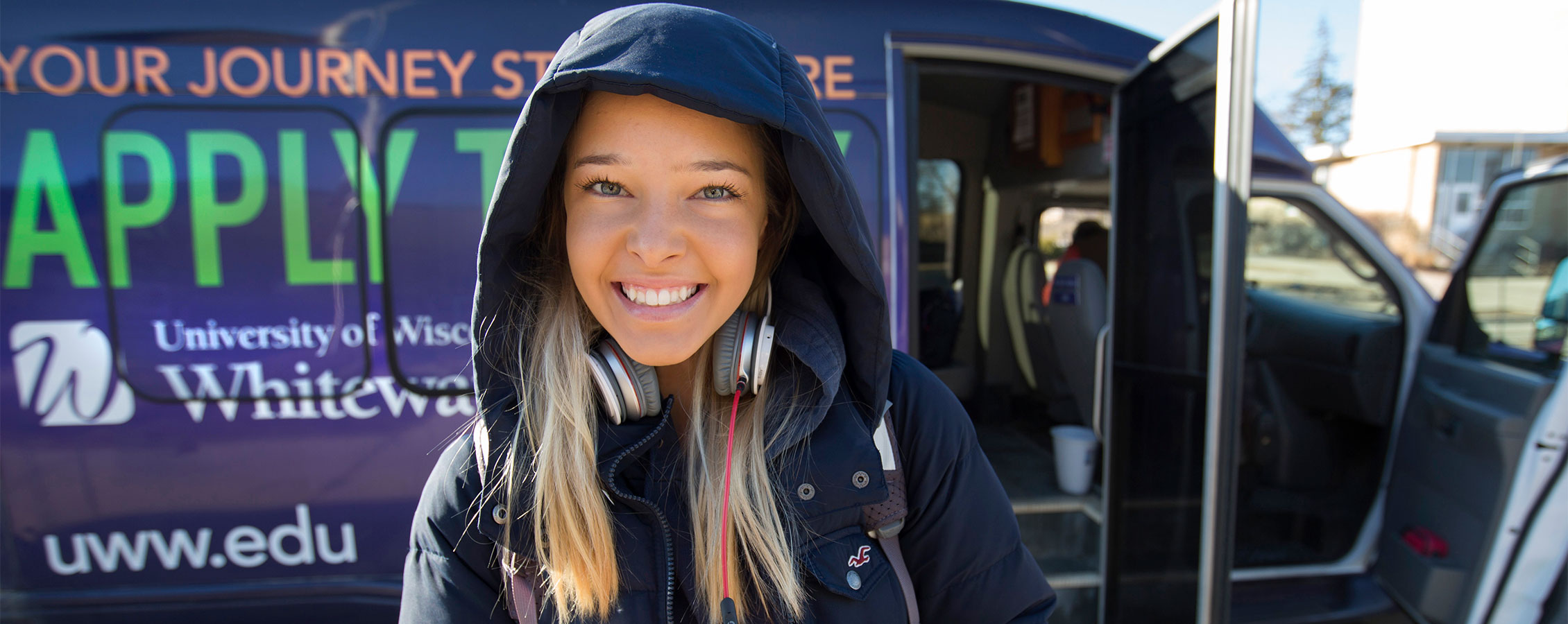 UW-Whitewater student waits for the Warhawk Shuttle.