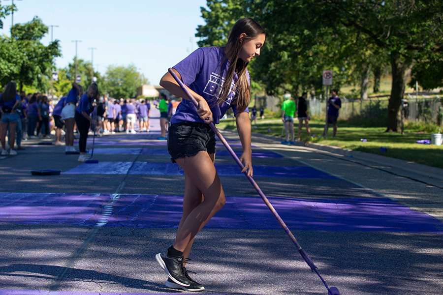 Student Painting Warhawk Drive street purple