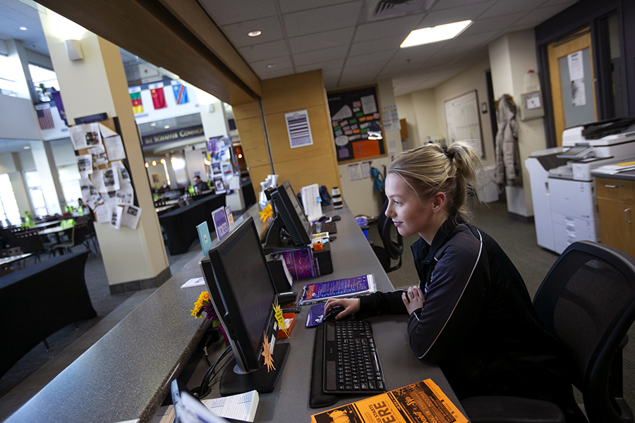 A student works at a desk in the University Center.