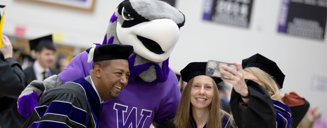 Two Whitewater graduates take a selfie with Willie