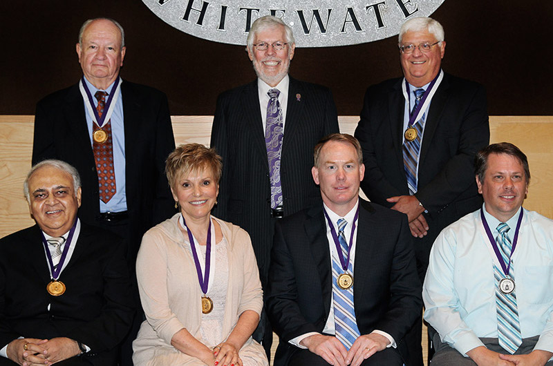 Award recipients with Chancellor Telfer (back left to right) Major General Grant R. Mulder '63, Chancellor Richard J. Telfer, Donald R. McIlnay '72 MBA '73 (front left to right) Jaydev H. Raja MBA '75, Karen L. Ahlgrim '73, Shawn M. Eichorst '90, Mathew T. Benson '02 