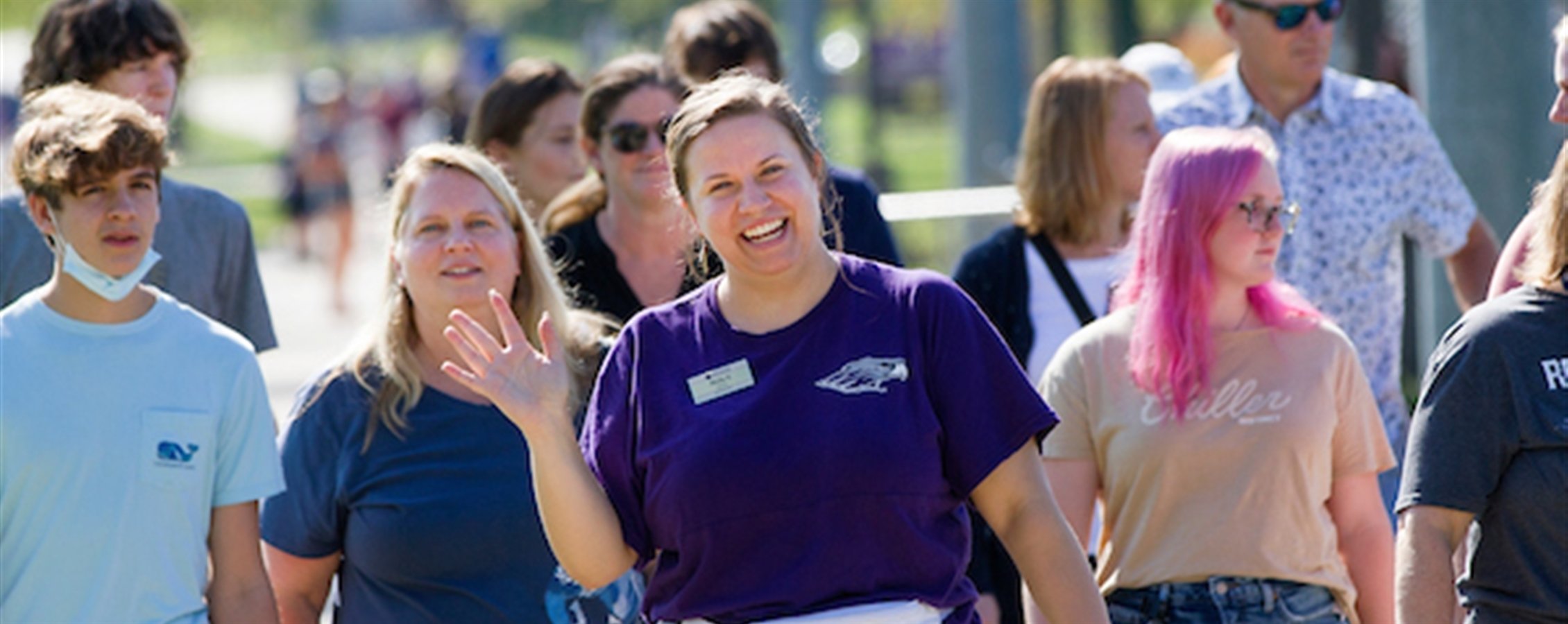 Students smile as they tour campus