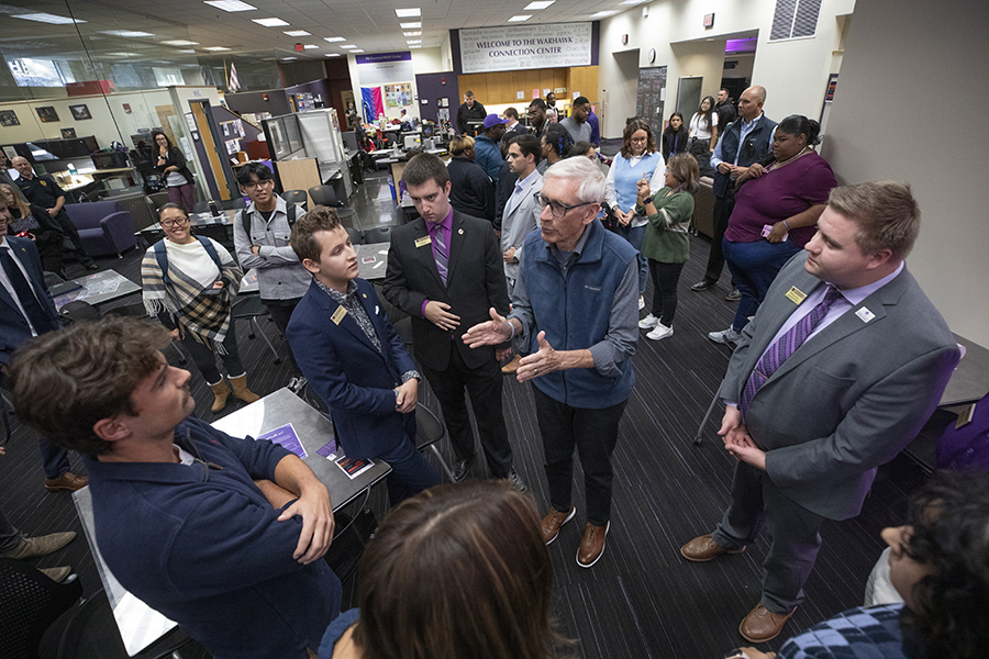 Members of Whitewater Student Government stand and talk with the Wisconsin governor.