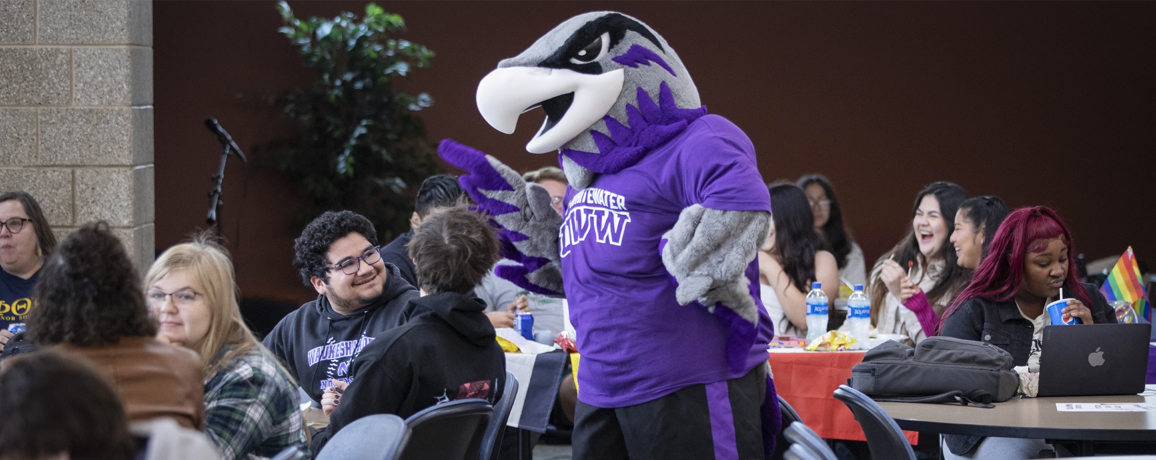 Willie Warhawk mingles in a crowd of people.