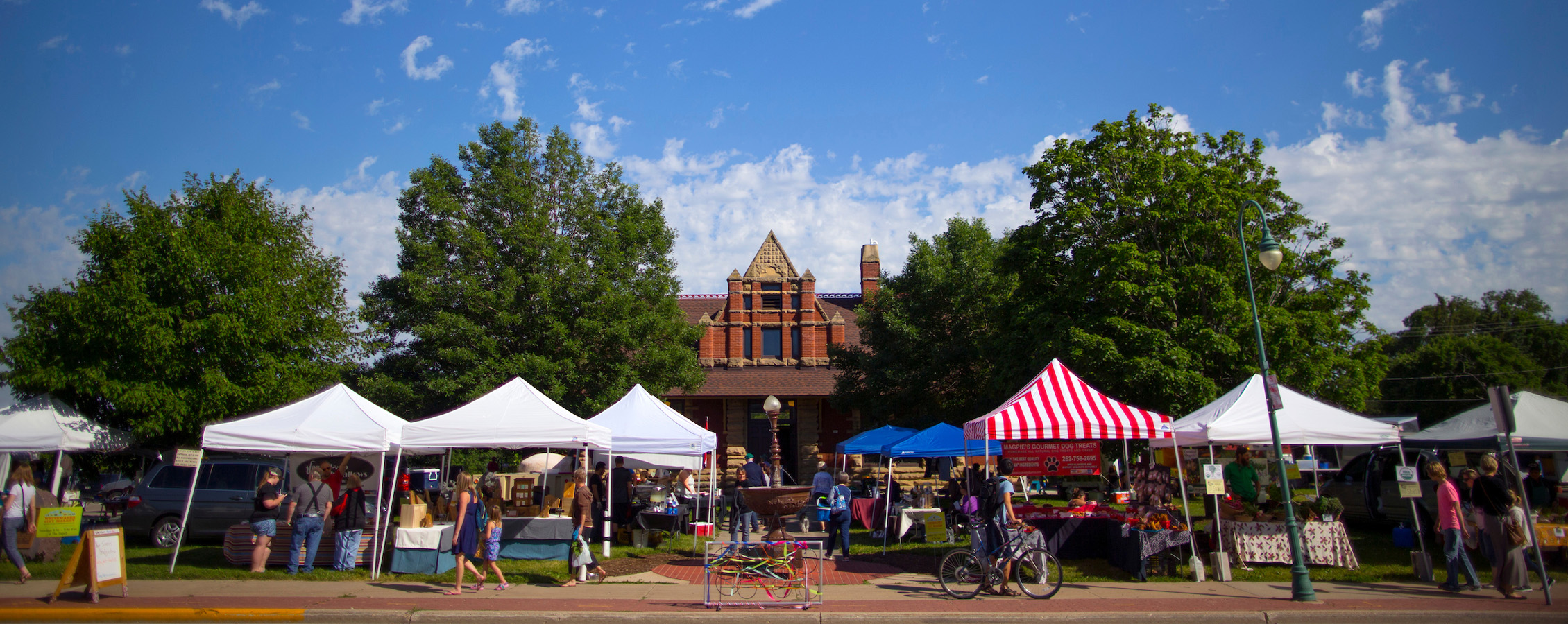 Colorful pop up tents line Whitewater's downtown area for the City Market.