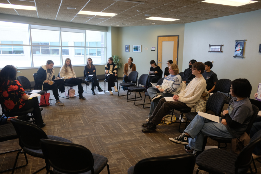 Students present in a circle