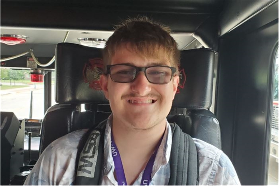 LIFE student smiling during a car ride.