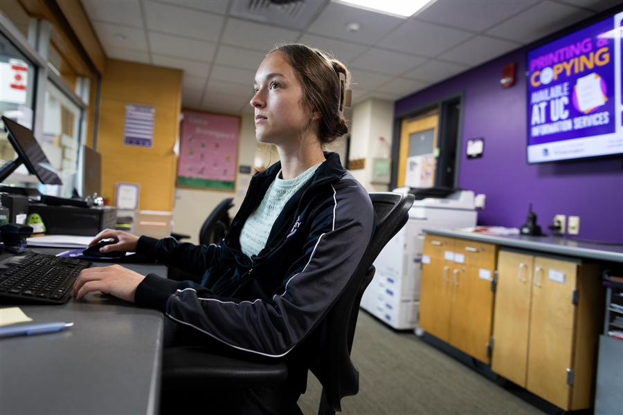 Ellie working on a computer in the University Center