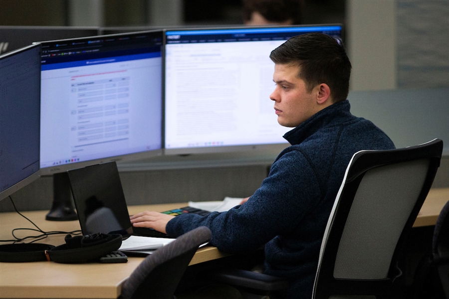 Student working on a computer in the Hyland Hall