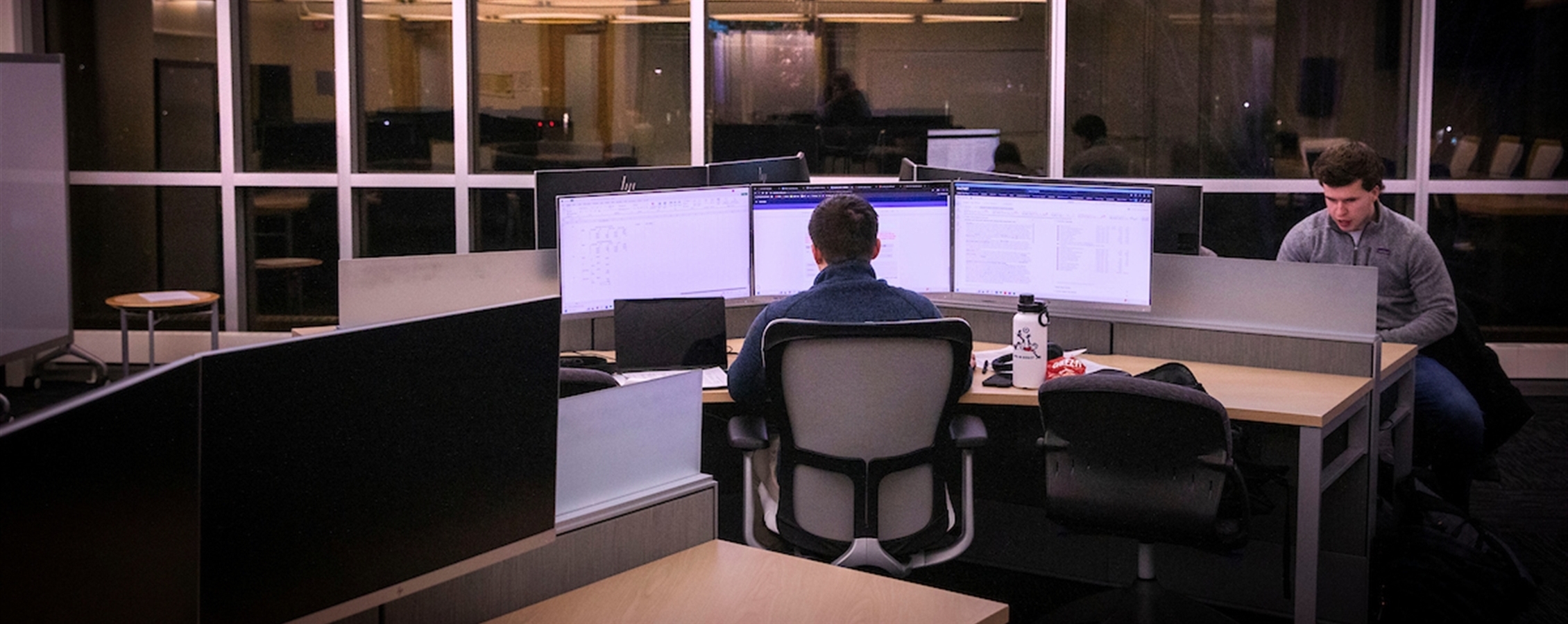Student working on a computer in Hyland Hall