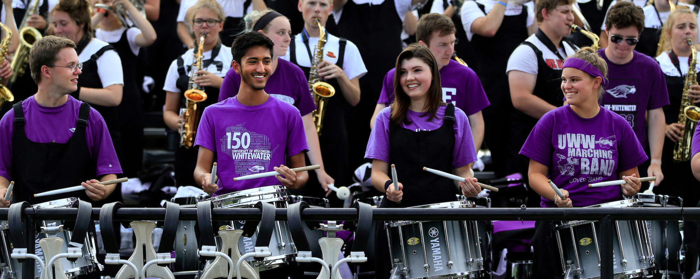 Warhawk Marching band plays in the stands of Perkins Stadium