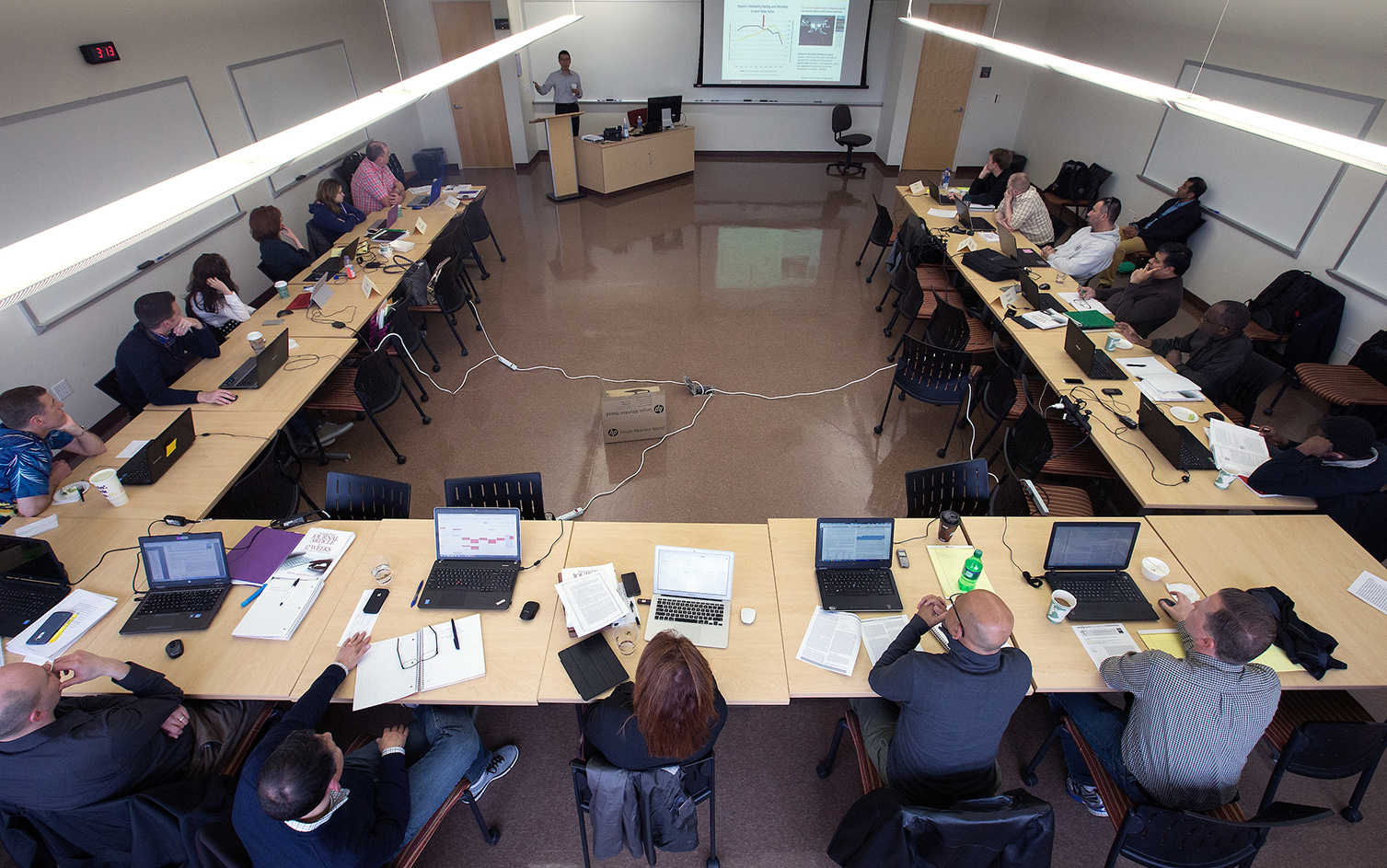 Henry Balani, seated at right with a green binder in front of him, was a member of the first cohort of UW-Whitewater’s DBA program.