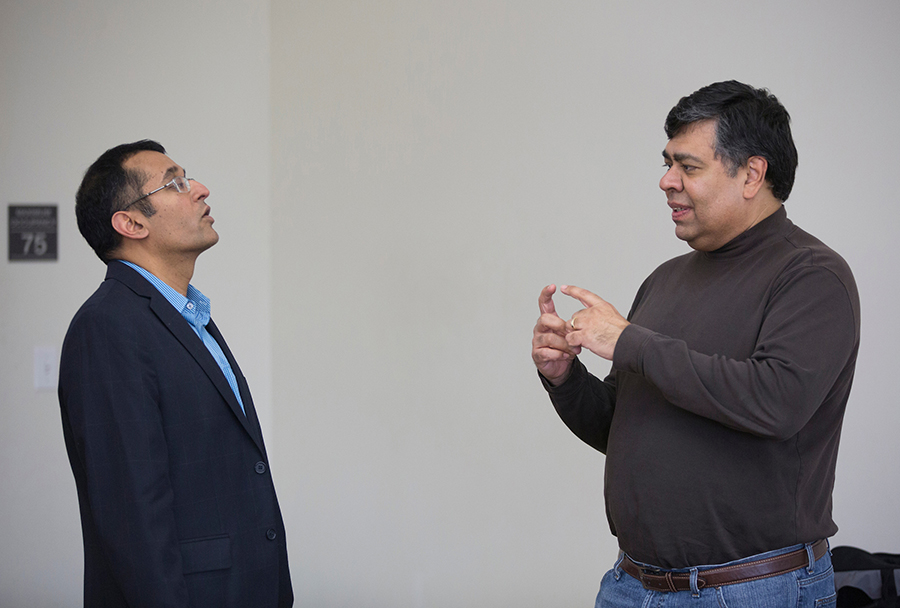 Henry Balani, right, in a discussion with Professor of Management Praveen Parboteeah, who established the DBA program at UW-Whitewater.