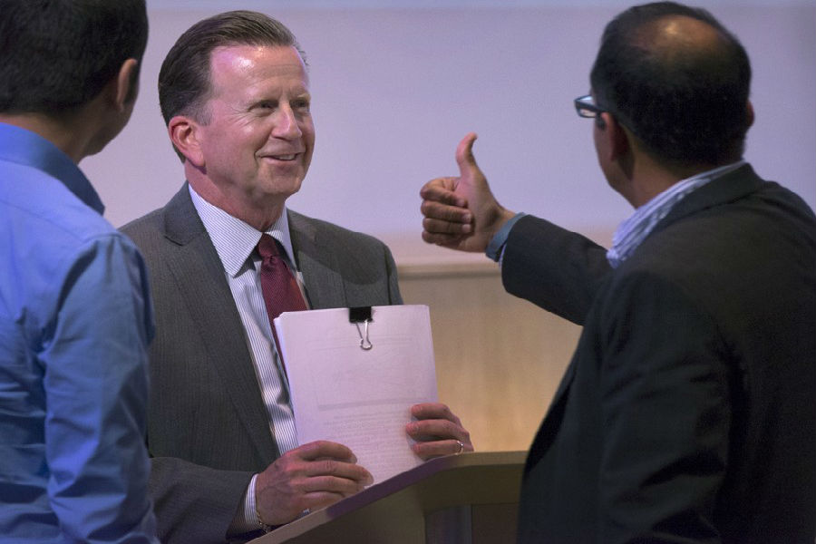 Doctor of Business Administration program director Praveen Parboteeah, right, gives a “thumbs up” to Stephen Gray immediately following Gray’s dissertation defense. (UW-Whitewater photo/Craig Schreiner)