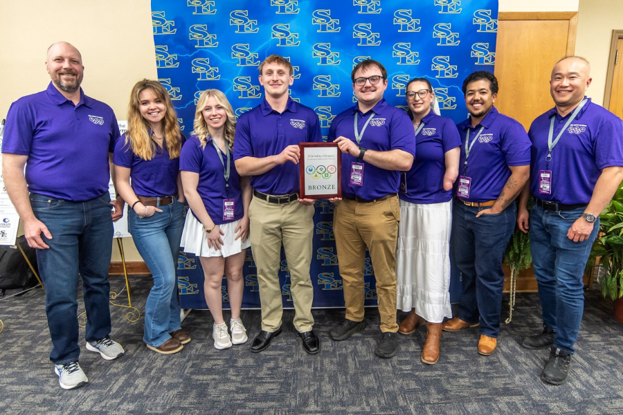 The UW&ndash;Whitewater team poses with their third-place award at the 2026 Safety Olympics