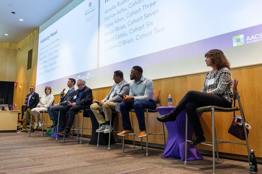 The industry and academic panel gather in Timmerman Auditorium.