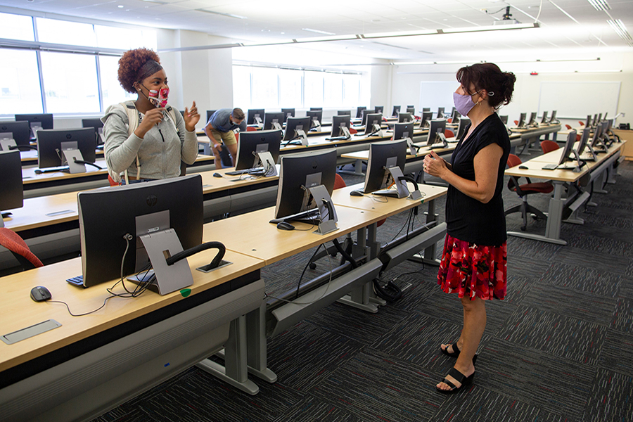 A human resources management major consults with Lecturer Linda Amann after an Information Systems 280 class in Hyland Hall on Sept. 2, 2020. (UW-Whitewater photo/Craig Schreiner)