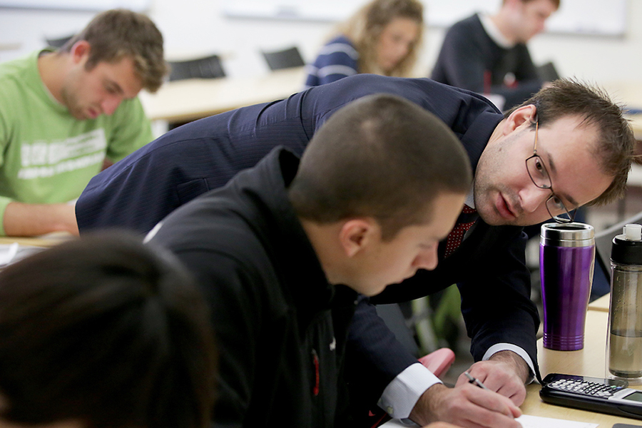 Professor Matthew Winden works with a student