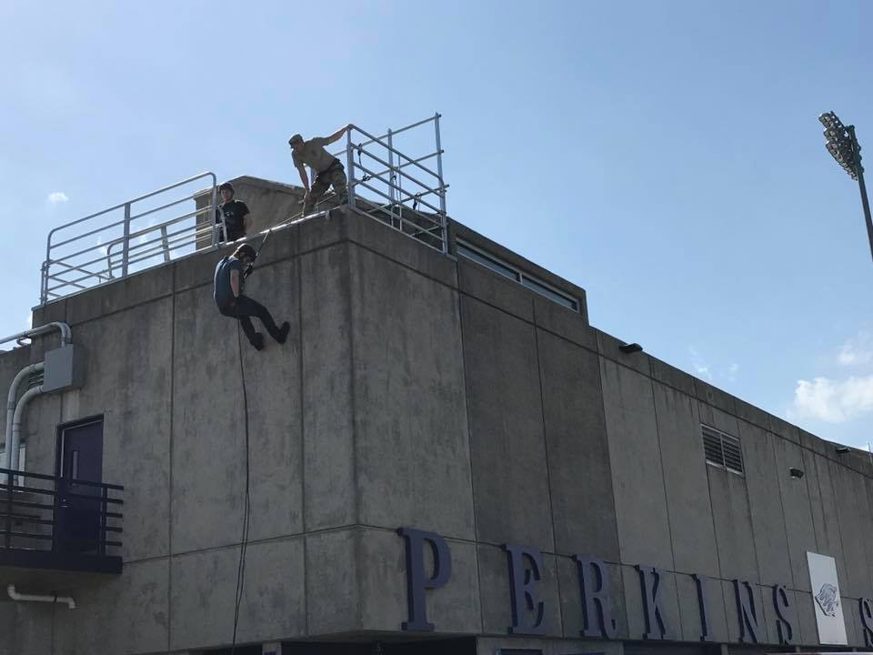 student reppel down a building