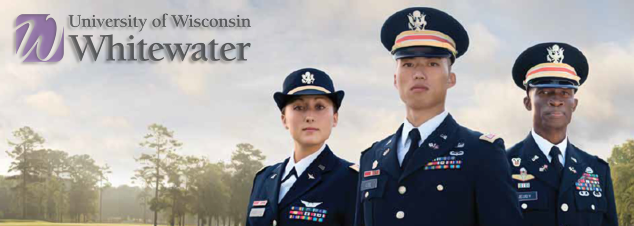 Three officers in uniform standing at attention