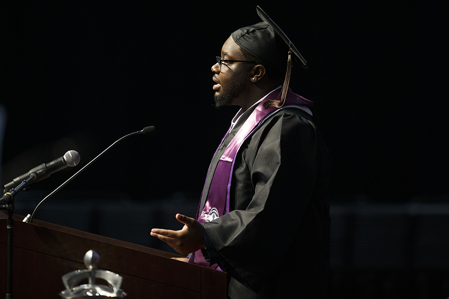 Jordyn Robinson speaks at the podium during commencement.