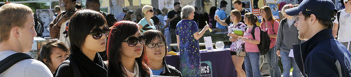 Dean of Students Banner with students talking