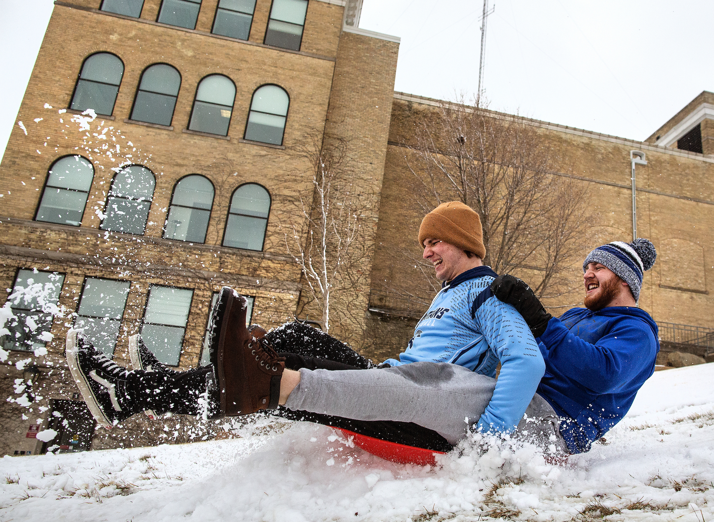 two people sledding