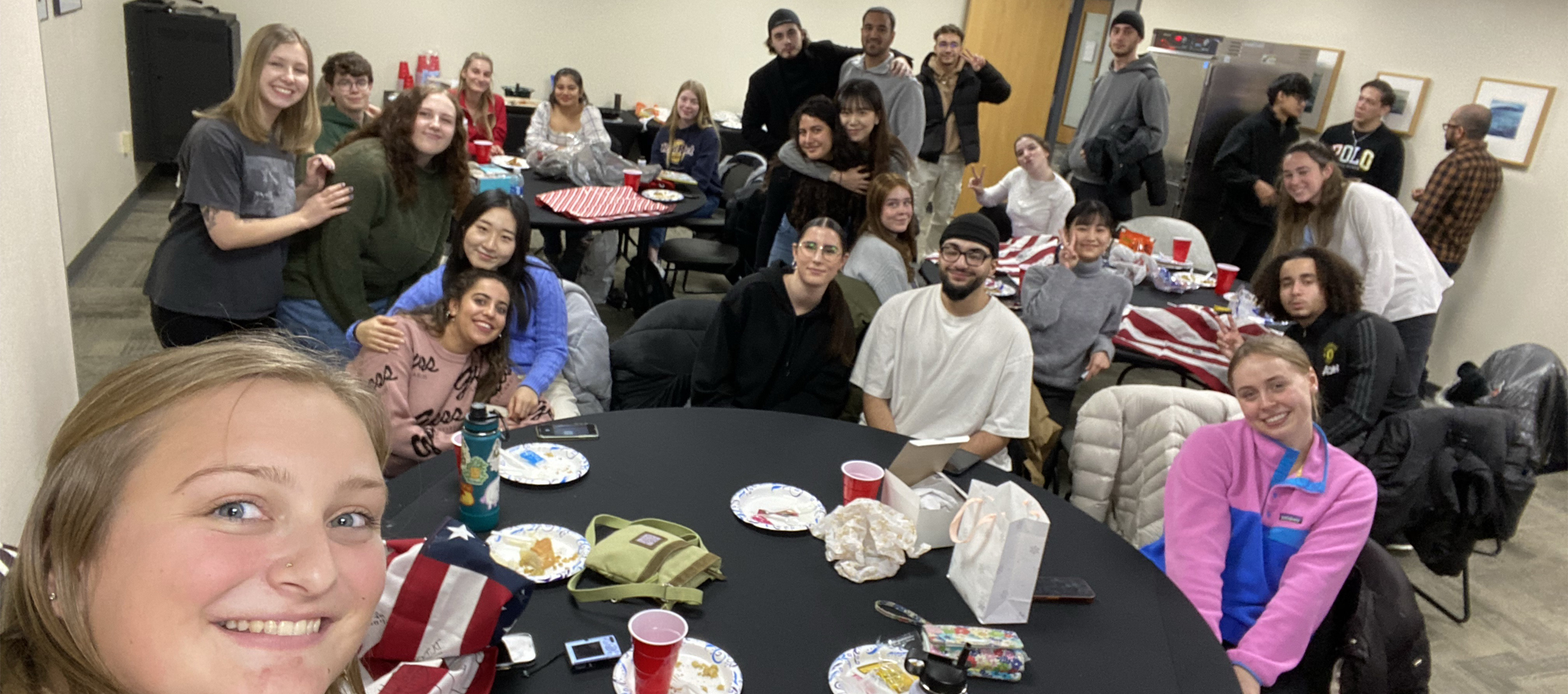 A group of international students pose for a photo in the University Center.