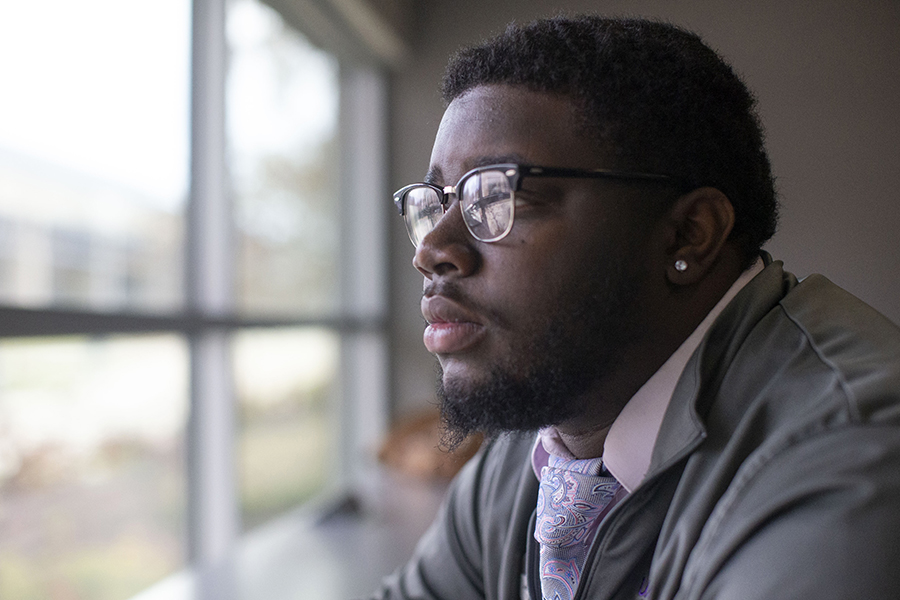 Jordyn Robinson looks out window in UW-Whitewater classroom