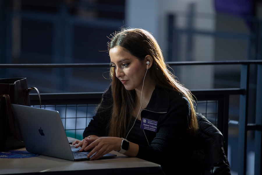 Professional on a laptop engaging in a webinar