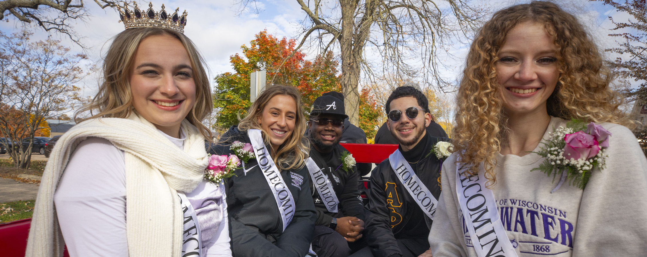 UW-Whitewater's Homecoming Court sits on a float at the parade.