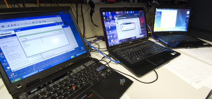 Three laptops on a desk