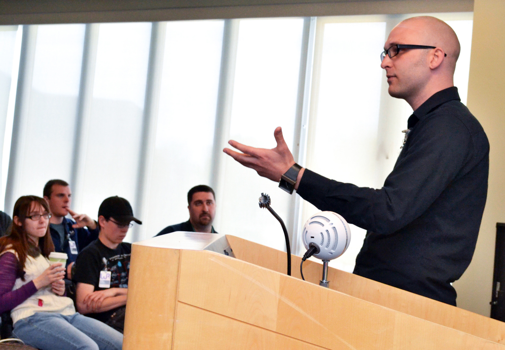 Man at a podium talking to an audience