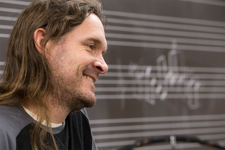 Side view of Jeff Herriott smiling during class.