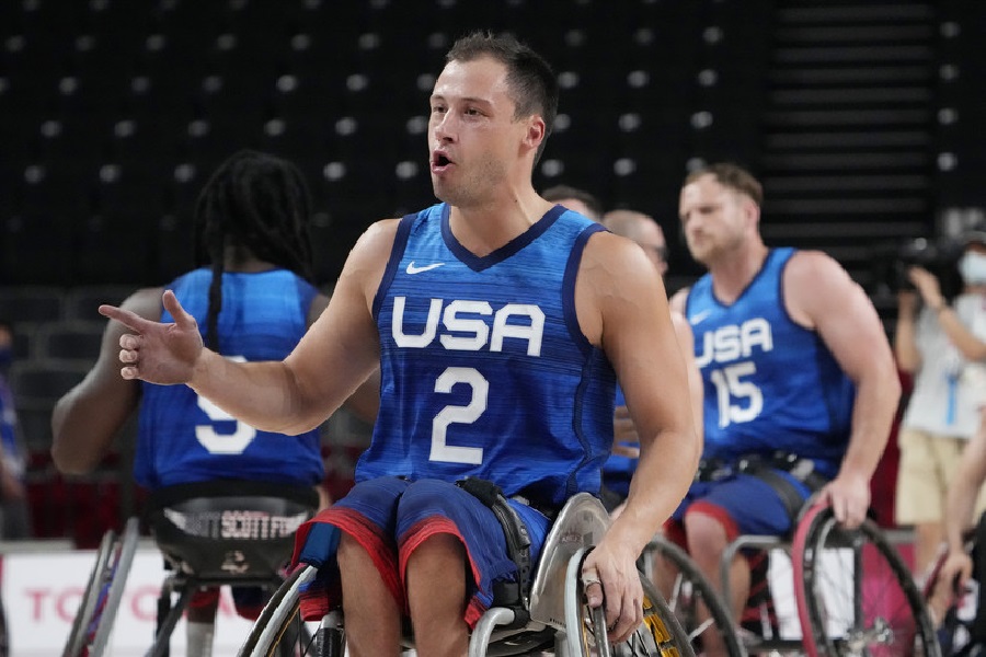 UWW coach Jake Williams celebrates with his teammates after the United States defeated Spain in a men's wheelchair basketball semifinal game at the Tokyo 2020 Paralympic Games