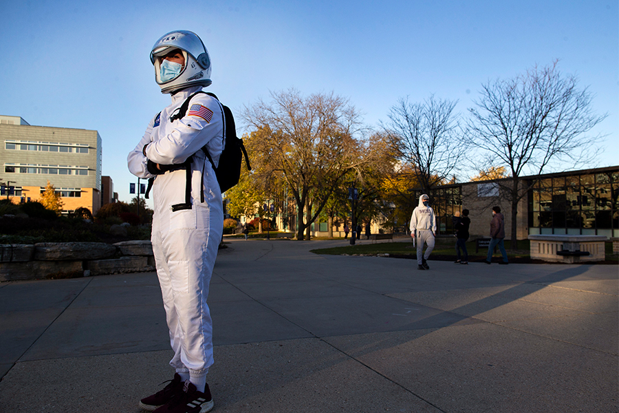 UW-Whitewater freshman Sid Lara makes sojourns as the character Astro on campus, walking or riding a longboard, sometimes giving out candy, and playing music from his smartphone. Astro's mission is to draw a smile from everyone he meets. 